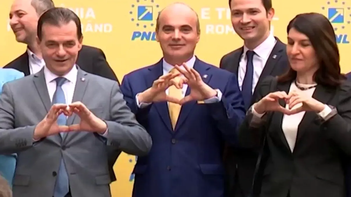 Ce se întâmplă, de fapt, în biroul unde se țin ședințele de lucru ale PNL. Orban fumează, iar masa e plină de alcool