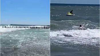 Oamenii au format un lanț uman pentru a salva doi copii și un tânăr care ignoraseră steagul roșu pus de salvamari în stațiunea Jupiter. Un bărbat şi-a pierdut viaţa înecat