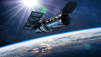 Descoperire spectaculoasă: Hubble a identificat o galaxie aproape invizibilă dominată de materie întunecată