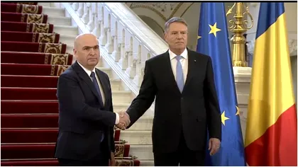 Ilie Bolojan vs. Klaus Iohannis. Gestul făcut de preşedintele interimar odată cu plecarea la Londra i-a făcut pe români să îl aplaude. Foto