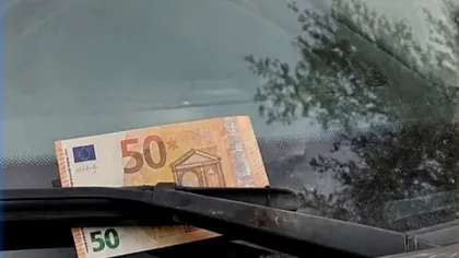 Ce faci dacă găsești o bancnotă pe parbrizul mașinii. Capcana de care sunt avertizați șoferii europeni