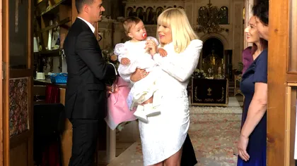 Câți bani a costat rochia pe care a purtat-o Elena Udrea la botez. A fost aspru criticată de Iulia Albu pentru această ținută
