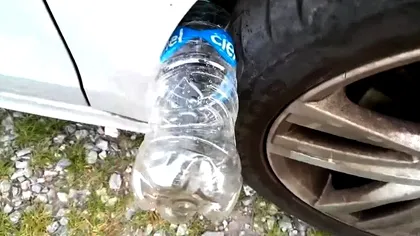 Atenție, șoferi! Ce înseamnă dacă găsești o sticlă cu apă la roata mașinii