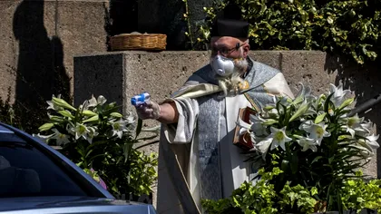 Un preot a fost surprins cum 