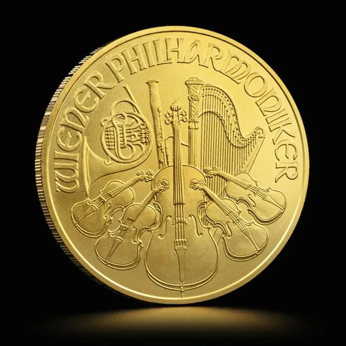 Moneda de aur are mai multe simboluri cu instrumente muzicale