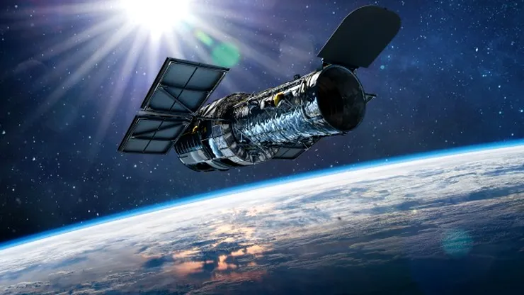 Descoperire spectaculoasă: Hubble a identificat o galaxie aproape invizibilă dominată de materie întunecată